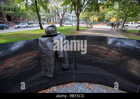 The Vendome Memorial, honoring 9 firefighters killed in the 1972 Hotel Vendome Fire, sculpted by Theodore Clausen, Commonwealth Avenue, Boston, MA Stock Photo