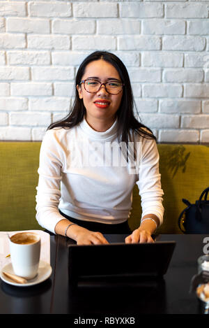 Desperate girl working and having a cup of coffee Stock Photo