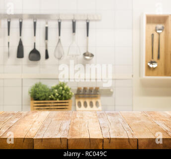 Wood table top on blur kitchen room background .For montage product display or design key visual layout. Stock Photo
