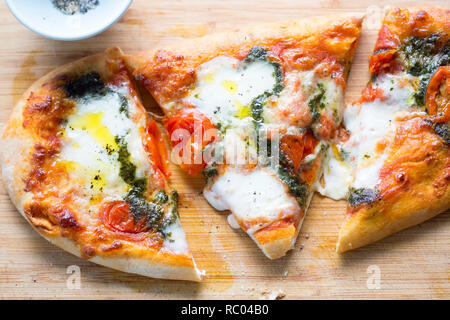 Mozzarella and basil pesto pizza Stock Photo