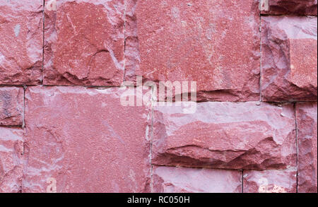 modern red stone tiled wall background. texture, geological. Stock Photo