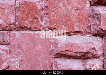 modern red stone tiled wall background. texture, geological. Stock Photo