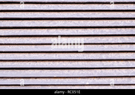 horizontal stripes of dusty metal jalousie exterior. background, texture. Stock Photo