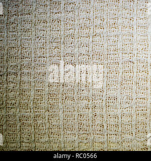 white cotton textile waffle fabric towel texture. background, kitchen. Stock Photo
