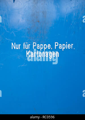 Blue German Garbage Can for Paper Waste, Text saying "Only for cardboard, paper and paperboard" Stock Photo