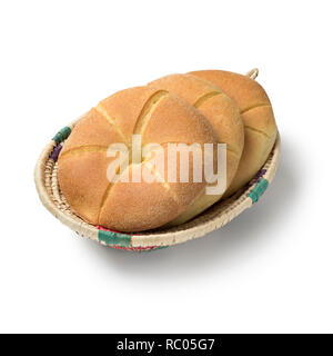 Traditional fresh baked Moroccan semolina bread in a basket isolated on white background Stock Photo