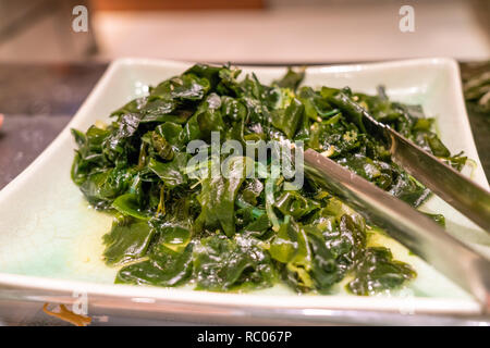 Dish of green wakame seaweed salad Stock Photo