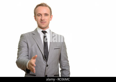 Handsome Caucasian businessman giving handshake isolated against white background Stock Photo