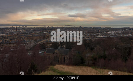 Edinburgh, Scotland, United Kingdom. View of the Edinburgh city from Calton Hill on early December morning with sunrise and sky horizon. Stock Photo