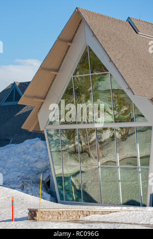 Reflection in windows of Old Faithful Visitor Education Center in Yellowstone National Park, Wyoming, USA.  (For editorial use only) Stock Photo