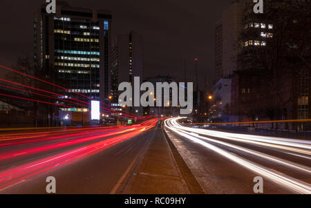 Some long expose shot with driving passed cars on Marylebone Road in central London at late night. Streetlights and lights in houses. Stock Photo