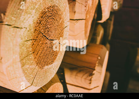 Wooden pattern. Abstract photo of a pile of natural wooden logs background. Stock Photo