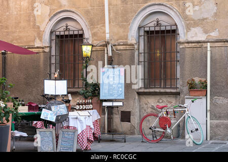 empty restaurant displaying menus and bicycle, Pisa, Tuscany, Italy, Europe, Stock Photo