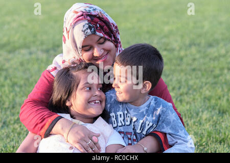 Mother with her two children posing in the Piazza dei Miracoli, Pisa, Tuscany, Italy, Europe, Stock Photo