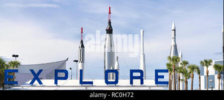 19 December 2019 - Cape Canaveral, Florida, USA. People  Explore sign above the entrance to Kennedy Space Center Visitor Complex. NASA Rocket Garden i Stock Photo