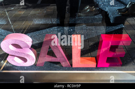 Sales sign on the vitrine. Big different colored letters saying sales. Living coral color. Colorful mock-up. Stock Photo