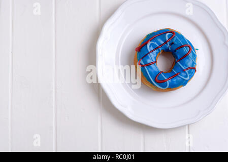 Colorful Donuts with Coffee in White Backdrop Stock Photo
