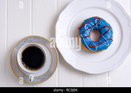Colorful Donuts with Coffee in White Backdrop Stock Photo