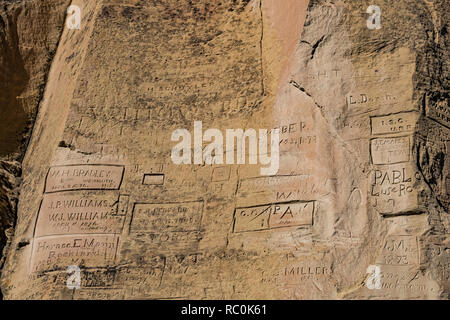 Names of wagon train and other emigrants carved into Inscription Rock in El Morro National Monument, New Mexico, USA Stock Photo