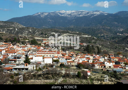 A view of the village of Omodos and the snow capped Mount Olympus in the Troodos Mountains, Cyprus. Stock Photo