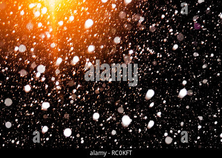 abstract background of falling snow. white snowflakes on a black background. design element Stock Photo
