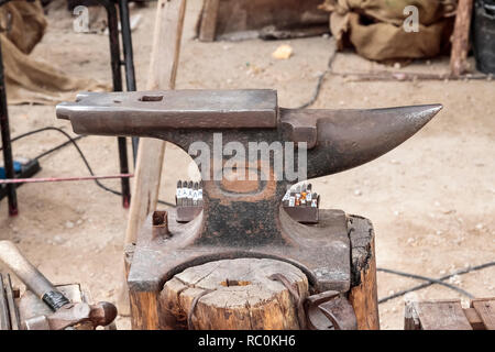 horizontal view of an outdoor scene with an old anvil on foreground Stock Photo