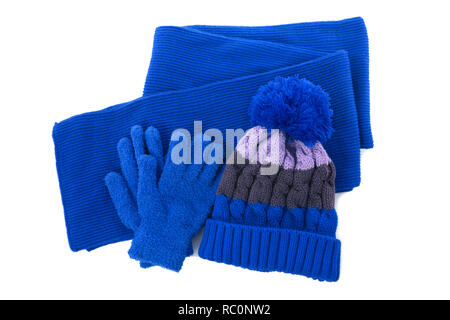 Blue winter knitted bobble hat, scarf gloves isolated Stock Photo