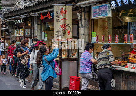 CHENGDU, CHINA - SEPTEMBER 25: Street food stalls selling local Sichuan food at Jinli Ancient Street on September 25, 2018 in Chengdu Stock Photo