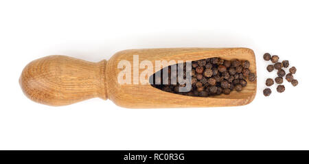 Black peppercorn in a wooden scoop isolated on white background. Top view. Stock Photo