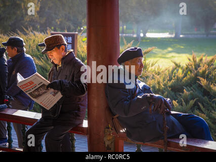 Seniors spending their Sunday at the gardens in the Temple of Heaven park in Beijing, China.The Temple of Heaven (Chinese: �쉯) is an imperial complex  Stock Photo