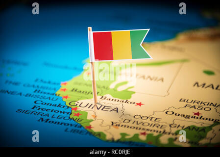 guinea Belgium marked with a flag on the map Stock Photo