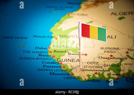 guinea Belgium marked with a flag on the map Stock Photo