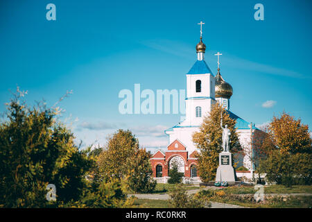 Luzhki, Vitebsk Region, Belarus. Monument To Heroes Who Died In Battles For Liberation Of Belarus At Great Patriotic War And Orthodox Church Of Nativi Stock Photo