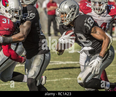 Oakland Raiders wide receiver Andre Holmes is upended by St. Louis Rams  cornerback E.J. Gaines after a six-yard gain in second quarter action  during a NFL football game between the St. Louis