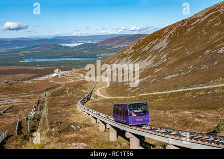 The Cairngorm Mountain funicular installation on Cairn Gorm in Cairngorms National Park Glen More  Scotland with car ascending & Loch Morlich behind Stock Photo