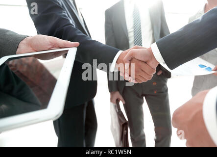 employees look at the handshake business partners Stock Photo