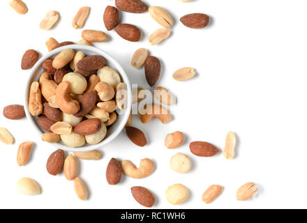 salted cocktail nuts in small cup isolated on white background, snack food concept and top view Stock Photo
