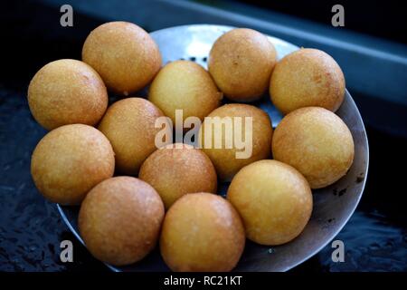 Colombian Bunuelos, fresh deep fried dough balls or Bunuelos in Colombia, South America Stock Photo