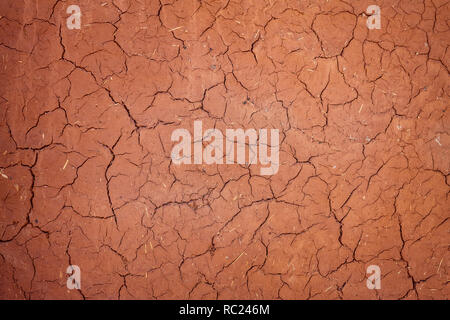 Texture cracked clay surface. Adobe african buildind wall Stock Photo