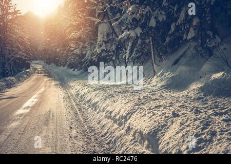 Scenic Winter Highway. Road and Trees Covered by Heavy Snow. Driving in the Winter Conditions. Stock Photo