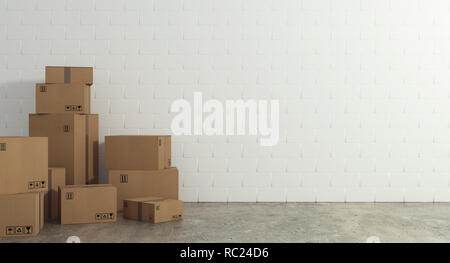 Stack of closed cardboard boxes wrapped with adhesive on the floor. Concept of moving and shipping Stock Photo