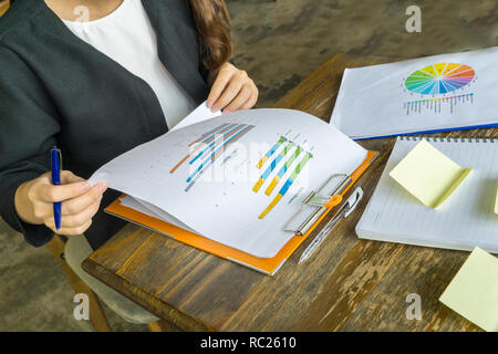 Manager checking sales reports Stock Photo