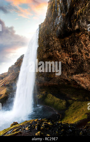 Seljalandsfoss waterfall scenic spot in Iceland famous for possibility to walk behind Stock Photo