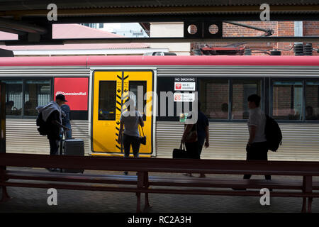 Passengers about to board a train at Roma Street station, Brisbane, Queensland, Australia Stock Photo