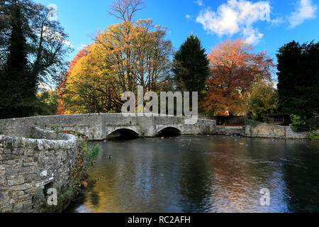 Autumn colours over the Sheepwash Bridge, river Wye, Ashford in the Water village, Peak District National Park, Derbyshire Dales, England, UK Stock Photo