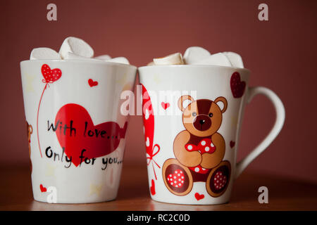 Hot chocolate with white marshmallows in hearts and teddy bears on Valentine's Day Stock Photo
