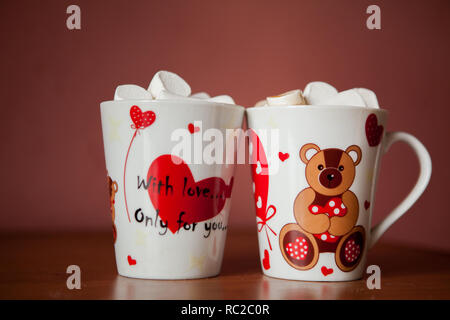 Hot chocolate with white marshmallows in hearts and teddy bears on Valentine's Day Stock Photo