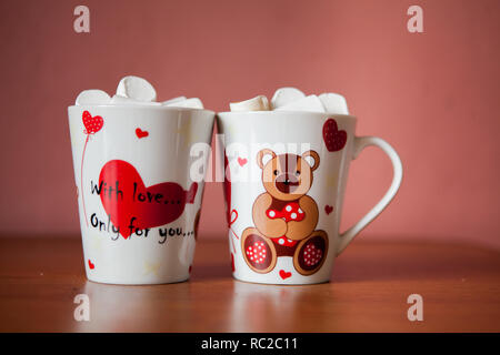 Hot chocolate with white marshmallows in hearts and teddy bears on Valentine's Day Stock Photo