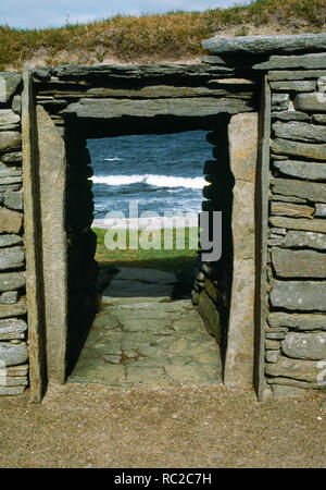 Knap of Howar, Neolithic Farmstead, Papa Westray, Orkney. Western Looking out through the western doorway of the southern building. Stock Photo