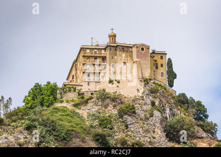 Facade and dome of the Tindari Sanctuary, built on a cliff with sheer drop on the sea and panoramic views of the Aeolian Islands and the gulf of Patti Stock Photo